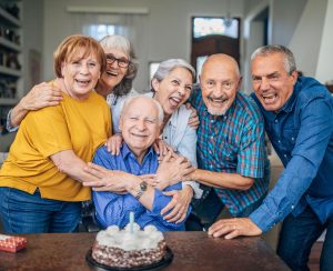Older friends celebrate birthday.